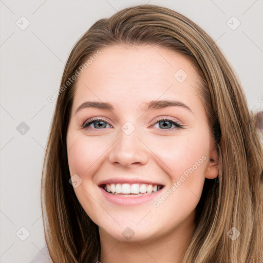 Joyful white young-adult female with long  brown hair and grey eyes