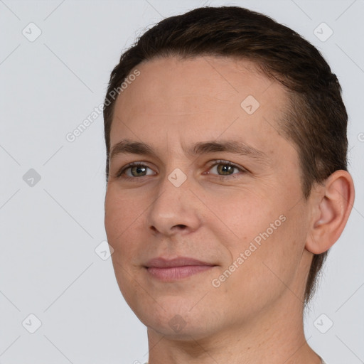 Joyful white adult male with short  brown hair and brown eyes