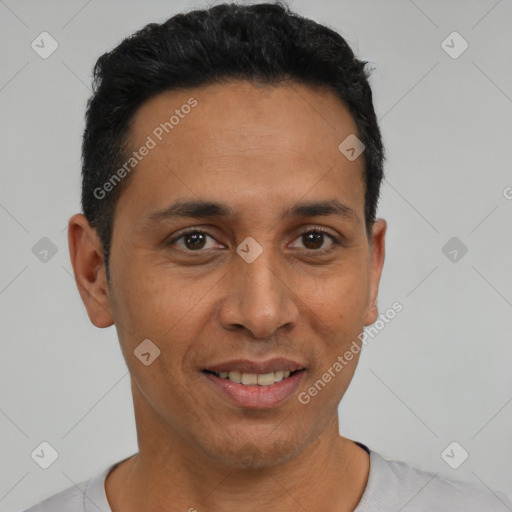 Joyful latino adult male with short  black hair and brown eyes