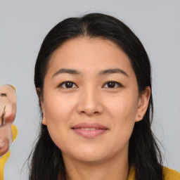 Joyful asian young-adult female with medium  brown hair and brown eyes