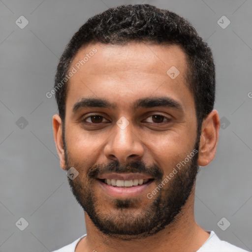 Joyful white young-adult male with short  black hair and brown eyes