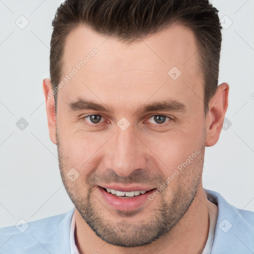 Joyful white young-adult male with short  brown hair and brown eyes