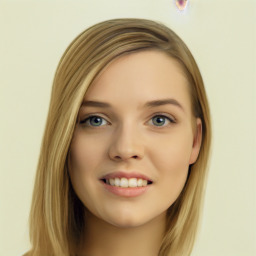 Joyful white young-adult female with long  brown hair and green eyes