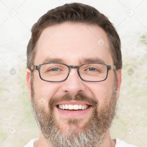 Joyful white adult male with short  brown hair and grey eyes