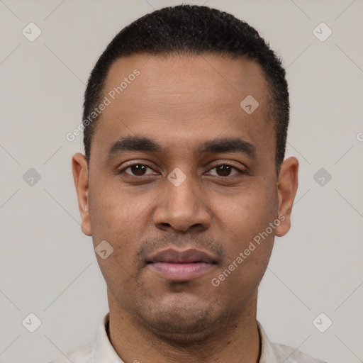 Neutral latino young-adult male with short  black hair and brown eyes