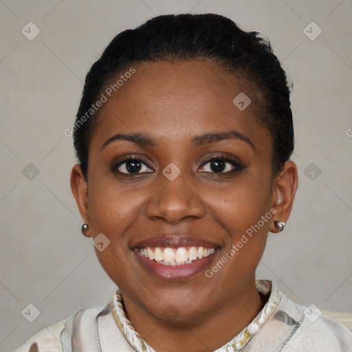 Joyful black young-adult female with short  brown hair and brown eyes