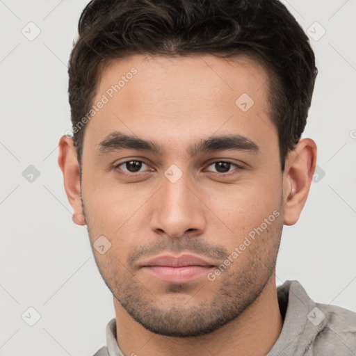 Neutral white young-adult male with short  brown hair and brown eyes