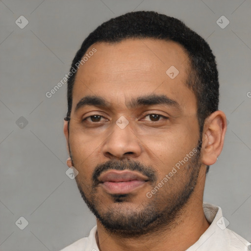 Neutral latino young-adult male with short  black hair and brown eyes