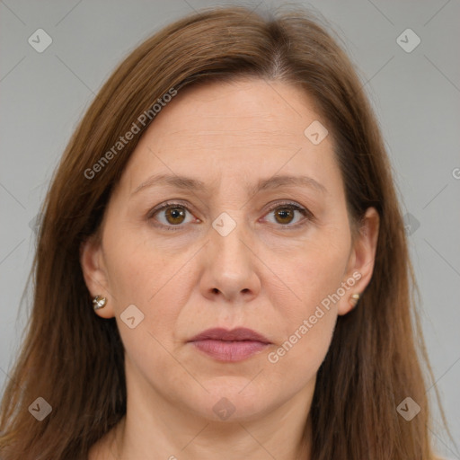 Joyful white adult female with long  brown hair and brown eyes