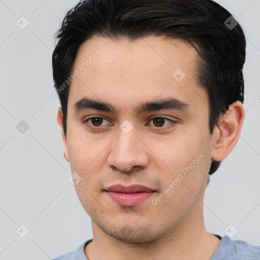 Joyful asian young-adult male with short  brown hair and brown eyes