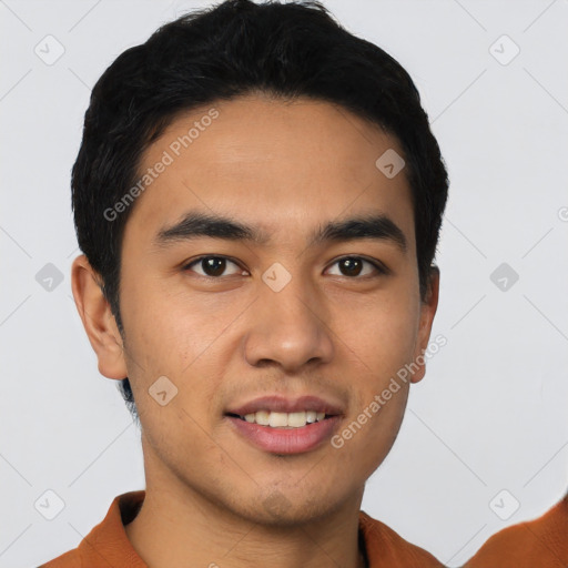 Joyful latino young-adult male with short  black hair and brown eyes