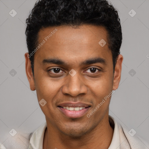 Joyful black young-adult male with short  black hair and brown eyes