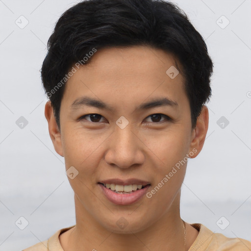 Joyful asian young-adult male with short  brown hair and brown eyes