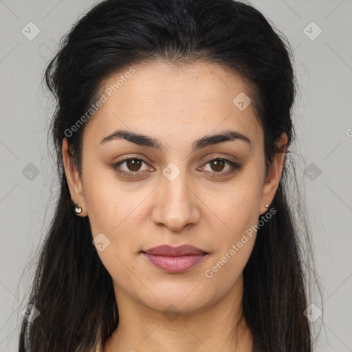 Joyful latino young-adult female with long  brown hair and brown eyes