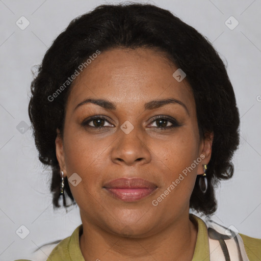 Joyful black adult female with short  brown hair and brown eyes