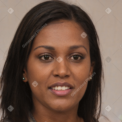 Joyful black young-adult female with long  brown hair and brown eyes