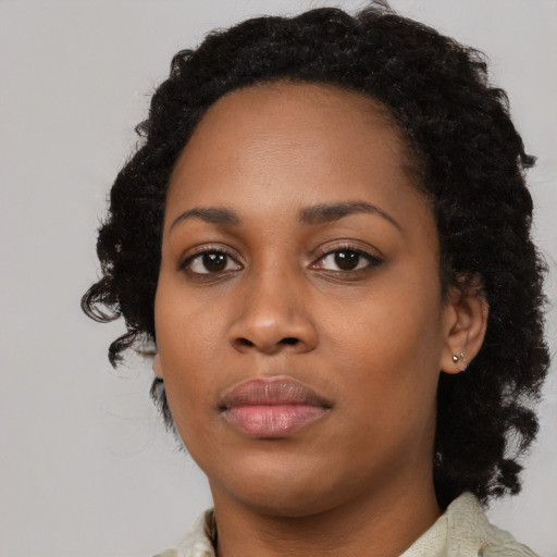 Neutral black young-adult female with medium  black hair and brown eyes