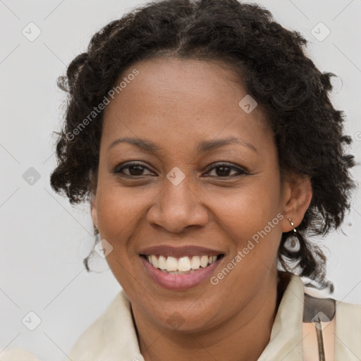 Joyful black adult female with medium  brown hair and brown eyes