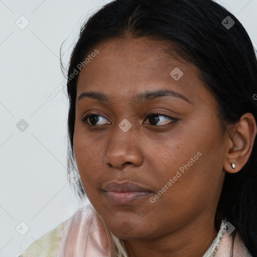 Joyful black young-adult female with medium  brown hair and brown eyes