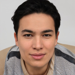 Joyful asian young-adult male with short  brown hair and brown eyes