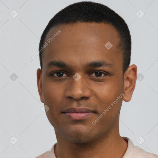 Joyful black young-adult male with short  black hair and brown eyes