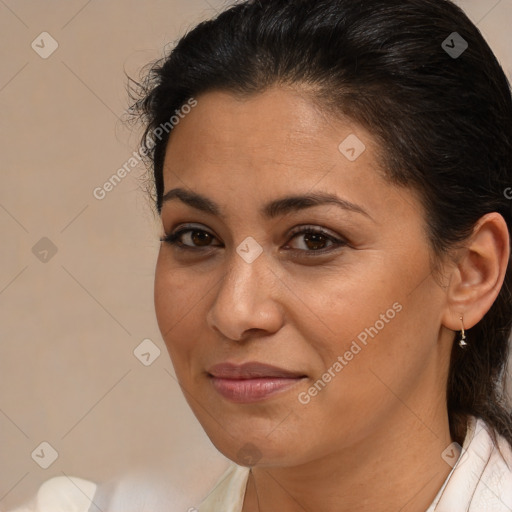 Joyful latino young-adult female with medium  brown hair and brown eyes