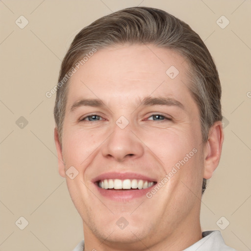 Joyful white adult male with short  brown hair and brown eyes