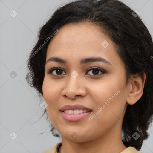 Joyful latino young-adult female with medium  brown hair and brown eyes