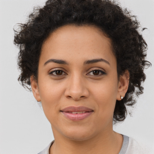Joyful latino young-adult female with short  brown hair and brown eyes
