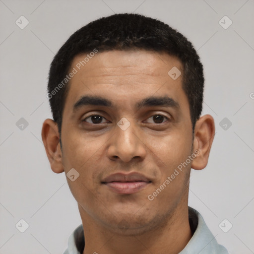 Joyful black young-adult male with short  black hair and brown eyes