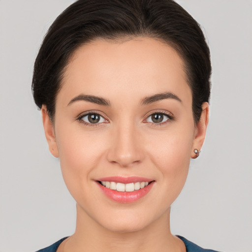 Joyful white young-adult female with medium  brown hair and brown eyes