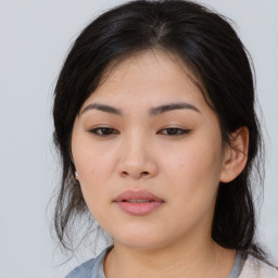 Joyful asian young-adult female with medium  black hair and brown eyes