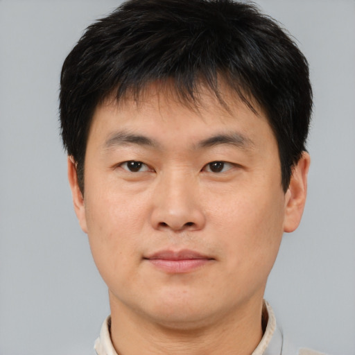 Neutral asian young-adult male with short  brown hair and brown eyes