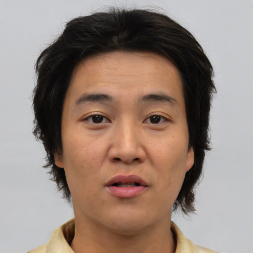 Neutral asian adult female with medium  brown hair and brown eyes