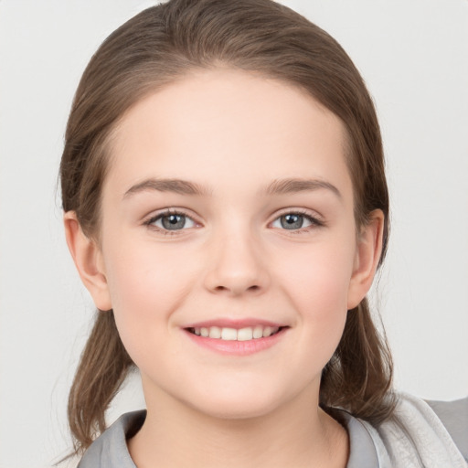 Joyful white child female with medium  brown hair and grey eyes