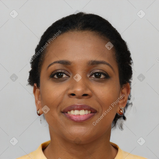 Joyful black young-adult female with short  black hair and brown eyes