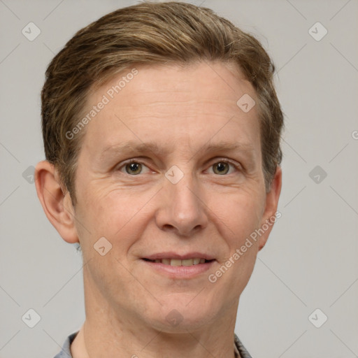 Joyful white adult male with short  brown hair and grey eyes