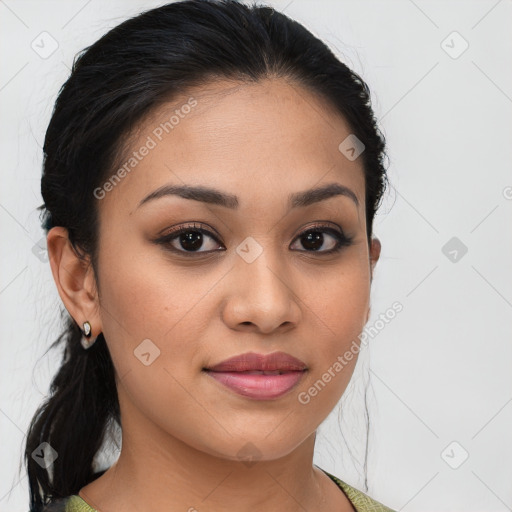 Joyful latino young-adult female with medium  brown hair and brown eyes