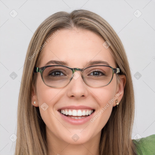 Joyful white young-adult female with long  brown hair and blue eyes