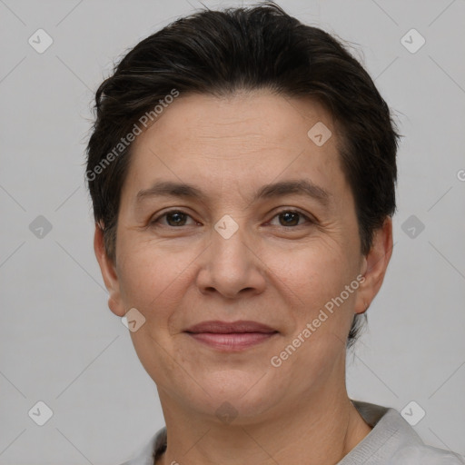 Joyful white adult female with short  brown hair and brown eyes