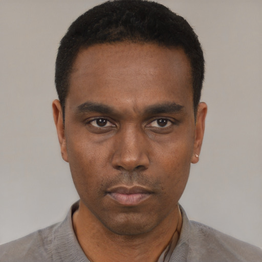 Neutral black adult male with short  black hair and brown eyes