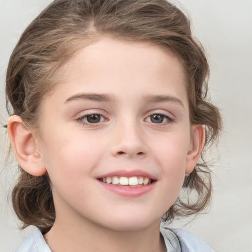 Joyful white child female with medium  brown hair and brown eyes