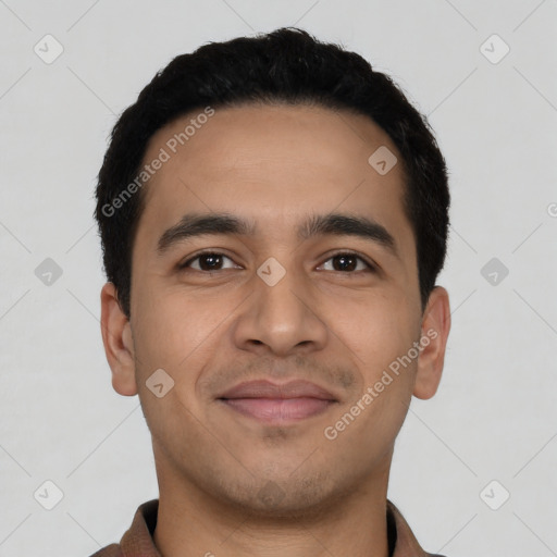 Joyful latino young-adult male with short  black hair and brown eyes
