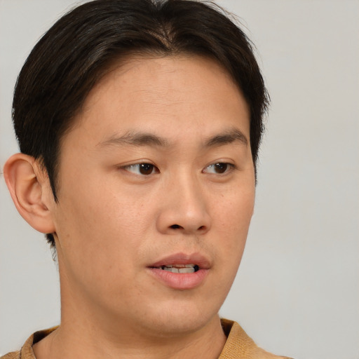Neutral asian young-adult male with short  brown hair and brown eyes