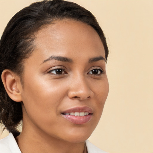 Joyful latino young-adult female with long  brown hair and brown eyes