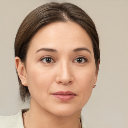 Joyful white young-adult female with medium  brown hair and brown eyes