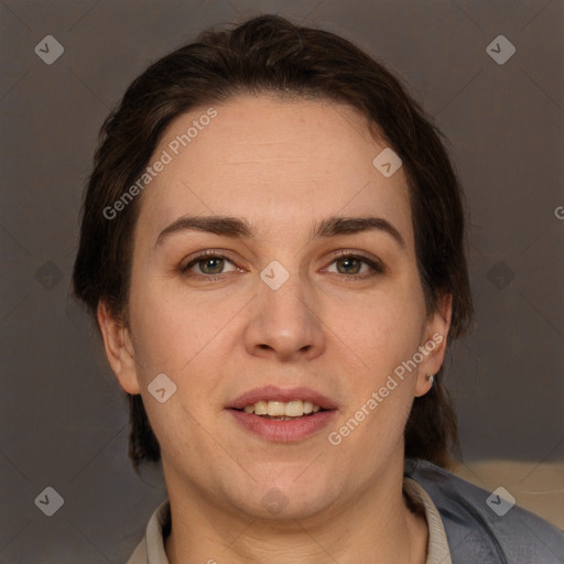 Joyful white adult female with short  brown hair and brown eyes