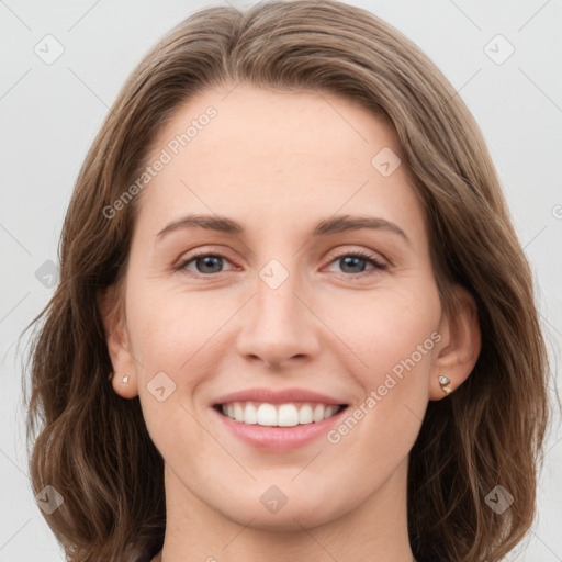 Joyful white young-adult female with long  brown hair and grey eyes