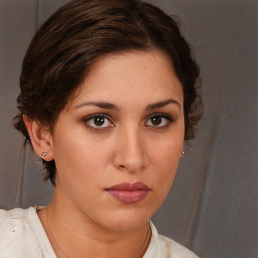Neutral white young-adult female with medium  brown hair and brown eyes