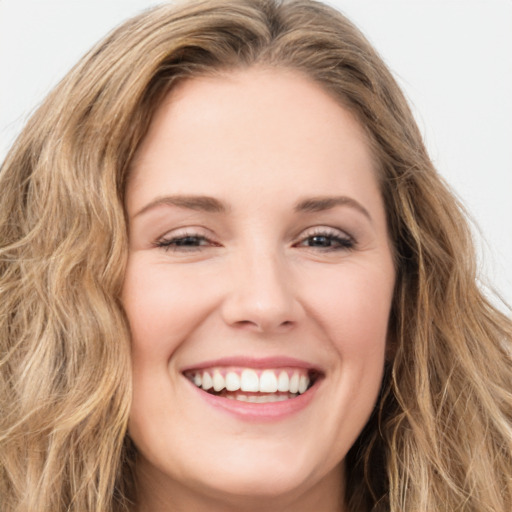 Joyful white young-adult female with long  brown hair and green eyes